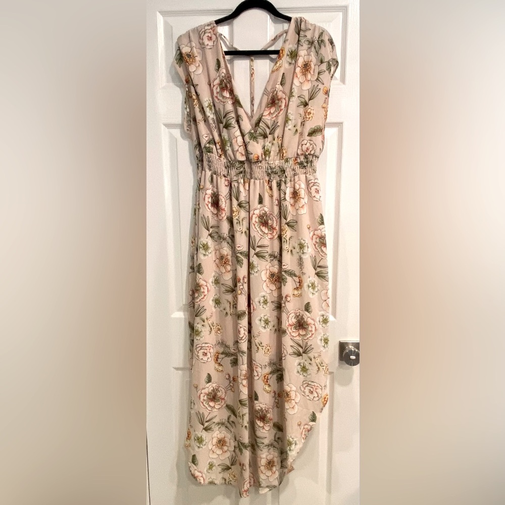 Blush maxi dress with high low sides at the bottom of the dress. New with tags